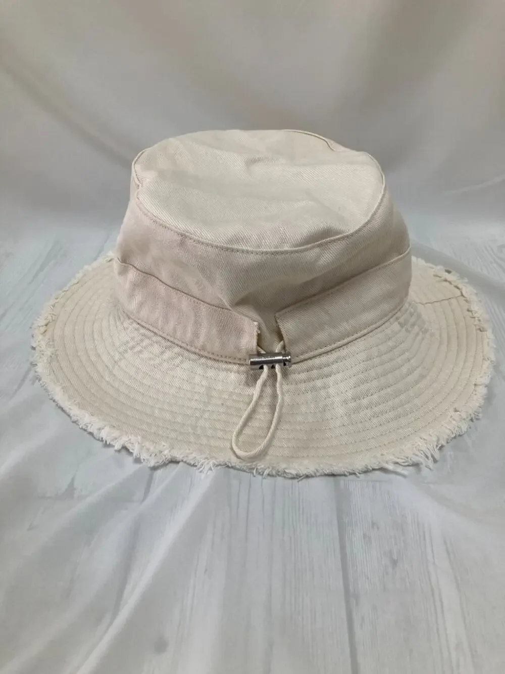Jacquemus Cream Frayed Brim Bucket Hat Metal Logo Adjustable Chin Strap